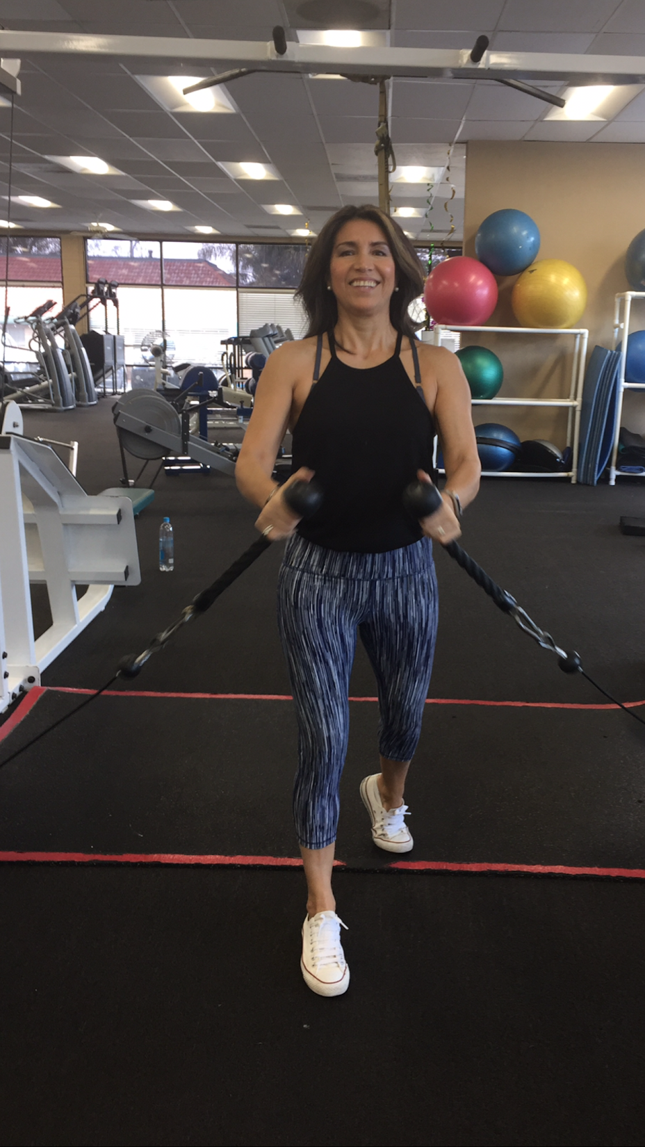 Catherina training with cables at the gym